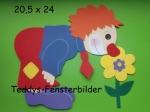 Clown riecht an Blume